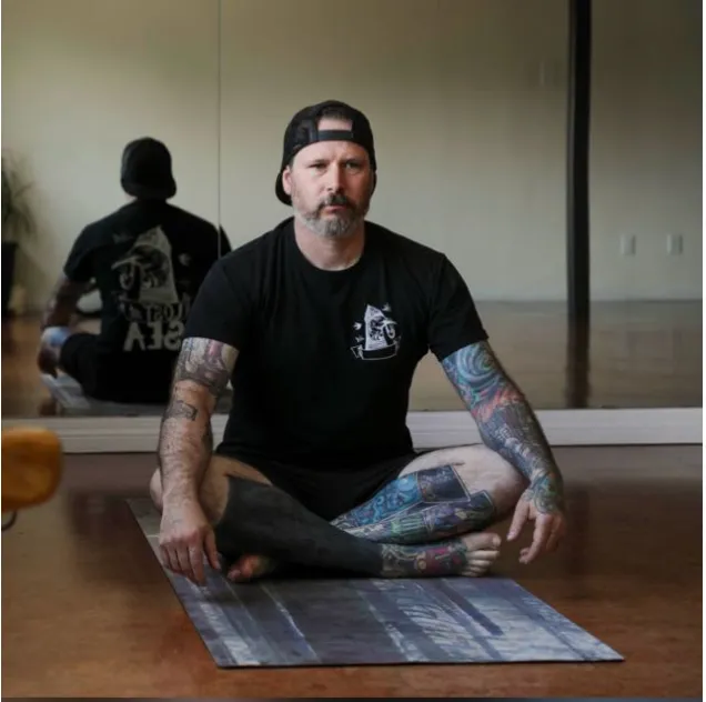 JP Gaudreau, owner of The Sheetmetal Guy, sitting with a length of fabricated ductwork